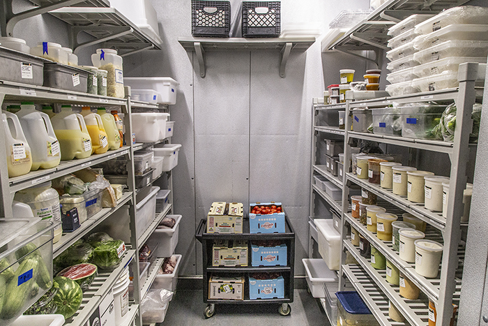 An organized walk-in refrigerator.